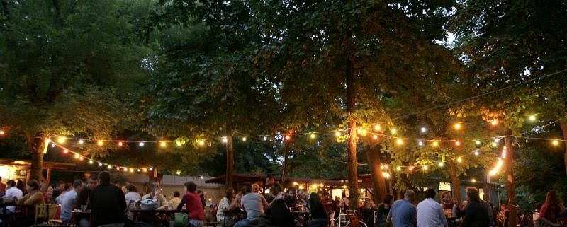 Evening picture of Kertem, an atmospheric garden bar in the City park on the Pest side of Budapest