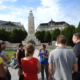 A group with our guide in blue uniform on the Liberty square, in front of the Soviet war memorial of Budapest