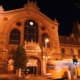 Photo the Central market hall of Budapest at night with an old yellow tram passing by (Evening tour finishes here)