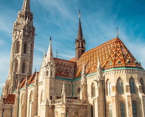 The renovated Matthias Church with its beautiful, colorful roof in the Castle district of the Buda side of the city - Guide to Budapest