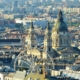 Photo of the city center of Pest with the Saint Stephen's Basilica and the Ferris Wheel in the foreground