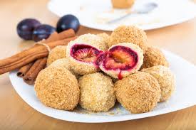 Szilvásgombóc is a dumpling rolled in breadcrumbs filled with plum and it is a beloved dessert of Hungarians