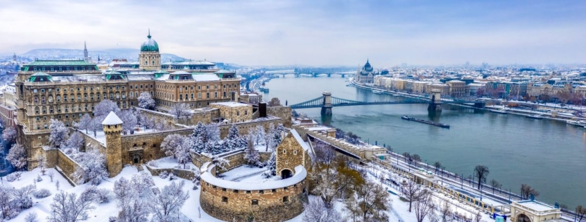 Aerial view of Buda with the Castle district and Pest with the Parliament and the river Danube in wintertime