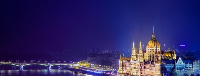 Beautiful image of the lit up Hungarian Parliament building and the river Danube