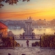 A sunset it Budapest with the iconic Chain bridge and a passenger