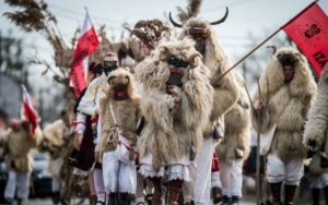 People dressed up in scary costumes during the Busójárás to scare winter and the Turks away