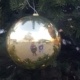 Reflection of Free Budapest Walking Tours guide in a Christmas tree ornament