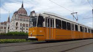 One of the oldschool carts of tram line number 2 in front of the Parliament in Budapest